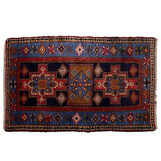 TAPETE. SXX. Estilo BOKHARA, lana y algodón, anudado a mano, diseños geométricos, en tono azul, rojo y marrón. 206 x 131 cm aprox.