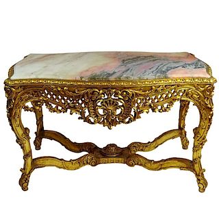 Large Rococo Style Carved and Giltwood Center Table with Marble top.