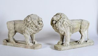 PAIR OF CAST-STONE FIGURES OF ROARING LIONS