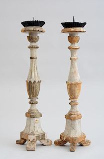 PAIR OF ITALIAN BAROQUE STYLE CARVED, PAINTED, SILVERED AND PARCEL-GILT PRICKET STICKS
