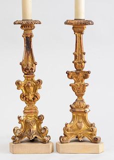 TWO SIMILAR ITALIAN ROCOCO STYLE CARVED GILTWOOD CANDLESTICK LAMPS