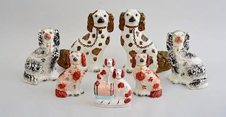 THREE PAIRS OF STAFFORDSHIRE FIGURES OF SPANIELS AND A SPANIEL GROUP