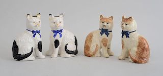 TWO PAIRS OF STAFFORDSHIRE POTTERY FIGURES OF SEATED CATS