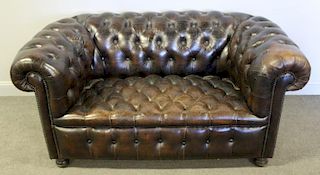 Leather Upholstered Chesterfield Settee.
