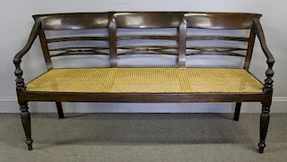 Regency Style Caned Bench with Fluted Legs.