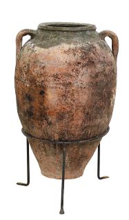 LARGE DUAL-HANDLED TERRACOTTA OLIVE JAR IN STAND