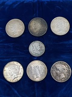Lot of 6 Peace Silver Dollars; three are dated 1922, 1923, 1924S, and one 1925. One 1953 Franklin Half Dollar., *This lot is tax exempt.