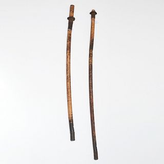 Pair of very long African tribal trumpets