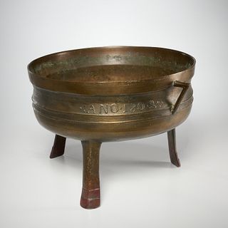 Large antique European bronze tripod cauldron