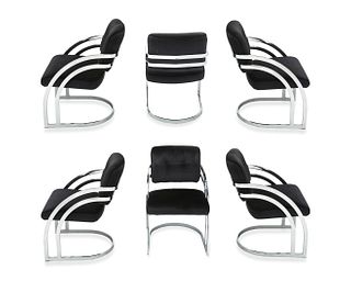 A set of Milo Baughman-style armchairs