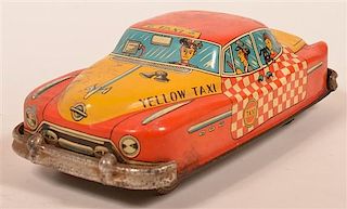 Yellow Taxi Tin Lithograph Friction Toy.