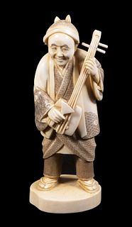 19TH C. IVORY OKIMONO OF A STANDING MUSICIAN