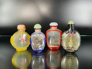 Four Reverse Painted and Cameo Glass Snuff Bottles