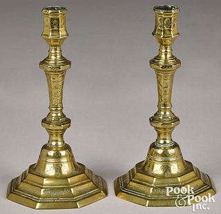 Pair of French engraved brass candlesticks, 18th c