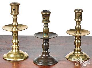 Three Dutch brass Heemskerk candlesticks