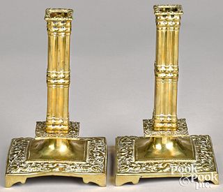 Pair of brass columnar candlesticks, 18th c.