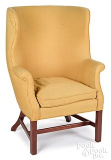 Chippendale style mahogany barrelback wing chair.