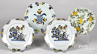 Four Delft polychrome plates, 18th c.