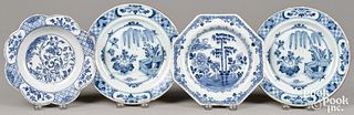 Three Delft blue and white plates and a bowl