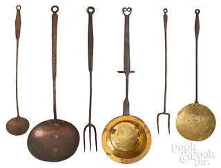 Six wrought iron and brass kitchen utensils