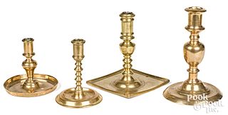 Three Spanish brass candlesticks, and another