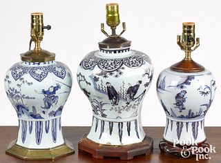 Three Delft blue and white table lamps, 18th c.