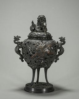 A hollowed out copper qilin and phoenix bird incense burner