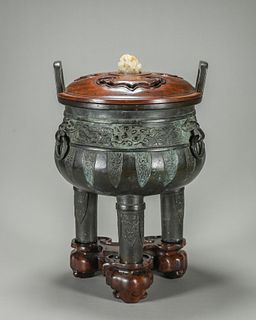 A jade-inlaid taotie patterned double-eared copper censer 