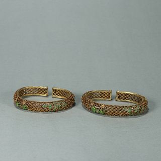 A pair of bamboo and orchid patterned gilding silver bracelets