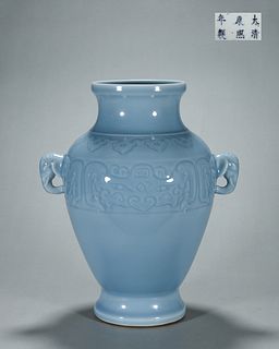 A taotie patterned celeste glazed porcelain zun with elephant head shaped ears