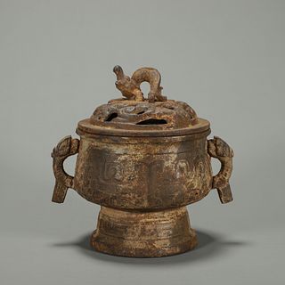 A taotie patterned copper pot 