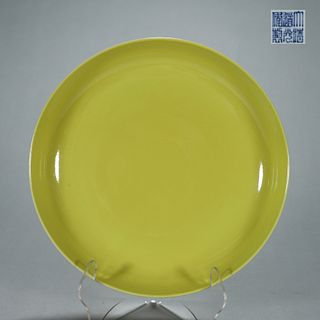 A yellow glazed porcelain plate