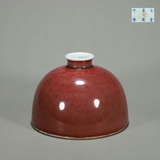 A red porcelain horseshoe shaped zun