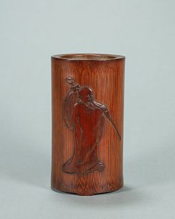 A monk carved bamboo brush pot