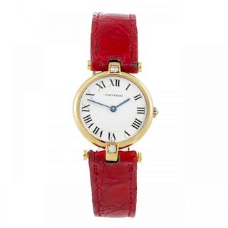 CARTIER - a Vendome wrist watch. Factory diamond set yellow metal case, stamped 18k, 750. Numbered 8