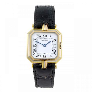 CARTIER - a Coussin wrist watch. Yellow metal case, stamped 18k 750, with tri-colour bezel. Numbered