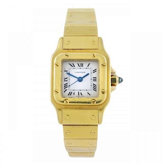 CARTIER - a Santos bracelet watch. Yellow metal case, stamped 18k with poincon. Numbered 090100374.