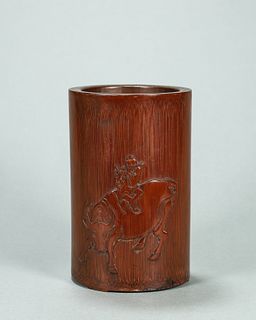 A figure and cattle carved bamboo brush pot