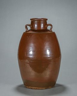 A brown glazed porcelain pot