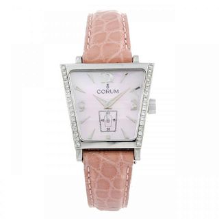 CORUM - a lady's Trapeze wrist watch. Stainless steel case with a row of factory set diamonds to eac