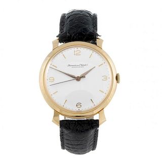 IWC - a gentleman's wrist watch. Rose metal case, stamped 18k, 0.750. Numbered 1460458. Signed manua