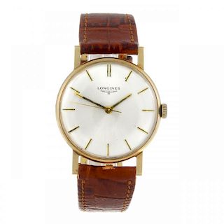 LONGINES - a gentleman's wrist watch. 9ct yellow gold case with engraved case back, hallmarked Londo