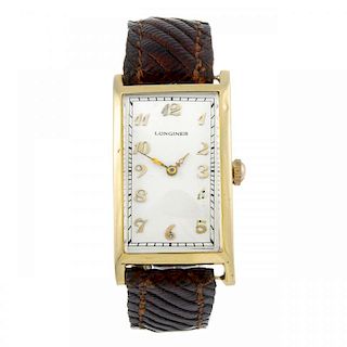 LONGINES - a gentleman's wrist watch. Yellow metal case. Numbered 4410703. Signed manual wind calibr