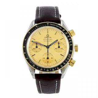 OMEGA - a gentleman's Speedmaster chronograph wrist watch. Stainless steel case with gold plated tac