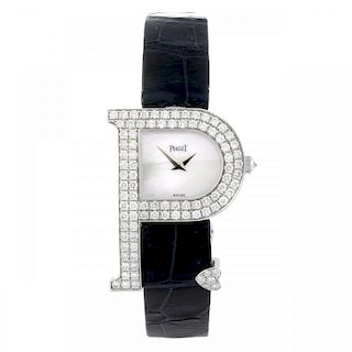 PIAGET - a lady's wrist watch. Factory diamond set 18ct white gold case in the shape of a 'P' with h