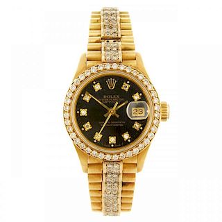 ROLEX - a lady's Oyster Perpetual Datejust bracelet watch. Circa 1988. 18ct yellow gold case with di