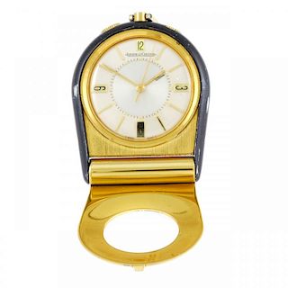 A travel alarm clock by Jaeger-LeCoultre. Numbered 1094815. Signed manual wind calibre K910. Two ton