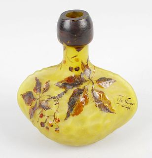 A French Art Nouveau yellow glass bottle vase, of bulbous form, with painted leaf decoration to hone