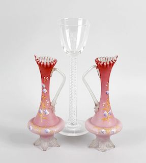 A large glass, with funnel shaped bowl upon a mercury air twist column and spreading circular foot,