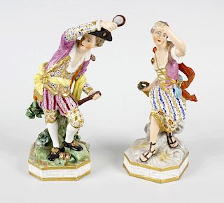 A pair of 18th century porcelain figures attributed to Derby, one modelled as a dandy with bicorn ha